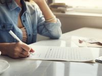 Caucasian woman writing a letter